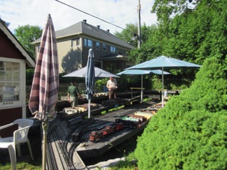 July 15.  The first thing to do is to get the car trays out of the shed and start distributing the cars. Nelson Yard is in the center of the picture, with Bell in the background against the fence.