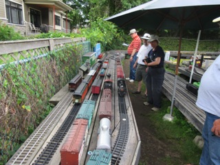 We get a new train. One of our stops is in Bell. It's a 3 way meet, but there is room for our train...as Steve and Seanna look on.