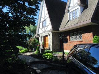 Doug has cleared the front of his house and replanted flowers.