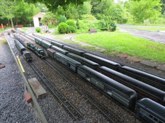 The yard is full of passenger cars.