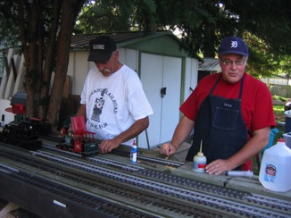July 14.  Here, Ken Brunt from Pennsylvania prepares his live steam Ruby, while Doug Mattheson from Ottawa offers advice.