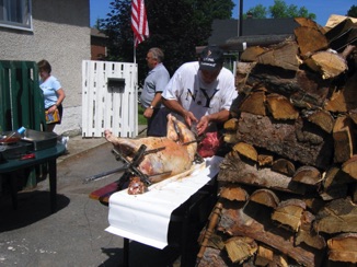 July 14.  They didn’t want us to go hungry, so they had plenty of food on hand.  It was roasted over an open barbecue for about six or seven hours. Mike Steele did the cooking AND the preparations.