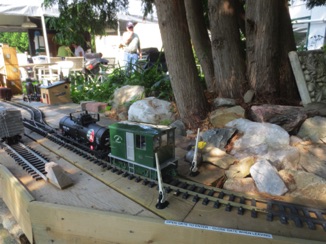 July 18.  We back up the spur with the tank car to drop. But, first we must open the gate.  That's my Sludgeworks in the background.