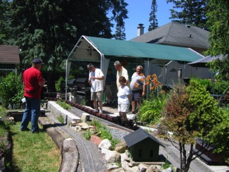 Everyone enjoyed watching double headed live steam Shays pull 17 hoppers around the railroad.
Frequent stops for water are a necessity.