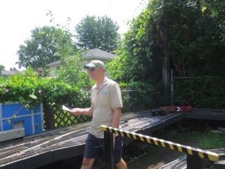 Bob runs after the train, with Bell in the background.