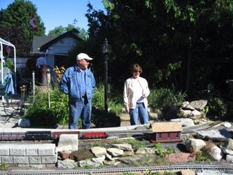 Jean and I share a train. I’m the conductor, while she is the engineer. Here, Ralph Dipple watches her move the train.