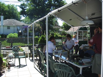 July 21.  The awning provides a gathering point and shelter from the sun.