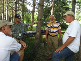 July 17.  We arrived at the Northland Railroad (Doug Matheson's) on Thursday afternoon. It wasn't long until a discussion arose.  Here, Ric, Gaetan, Peter, and Doug discuss something very monumental.