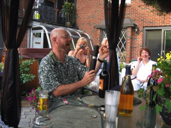 July 17.  That evening we all sat down for some wine followed by a great barbecue.  Gaetan had fun playing with the electric wine opener, though it did take him some time to master.