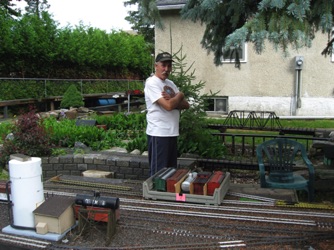 July 18.  Friday dawned rather cloudy, but we were prepared for our first operating session. Ken and I helped to set out the cars in preparation for the session. All of the cars are stored in color coded trays to make it easier to place them in the correct location.