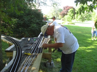 July 15.  We got an opportunity to work on the raised loop section. Here Doug performs some work on the switch.