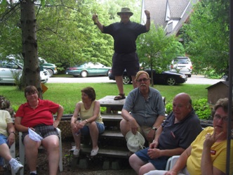 July 15.  It turned into a rather large gathering and Doug provided a great barbecue. Here the crew relaxes in the garden prior to dinner. Left to right: Lela, Jean, Fred, Stu, Jim, and Sue.