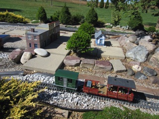 I took my boxcab and ran my odometer car around the layout between various locations so Andy would have some measurements of his track length.