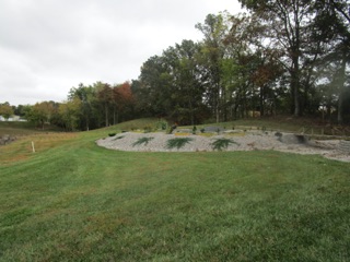 The power plant is inside a loop of track.