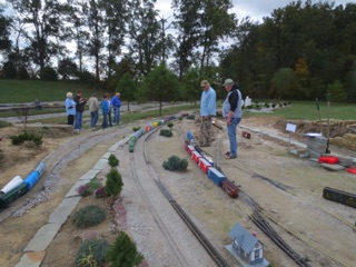 We climb the hill out of Memphis and soon come up to Overlook - where we switched yesterday. Today, Ken and Doug have the job, while the car club members look on.