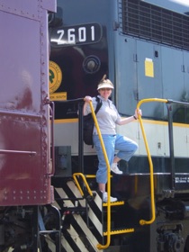 Jan climbs down from her ride on the diesel.