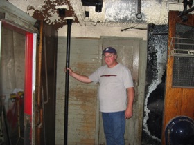 Doug poses next to a pipe...