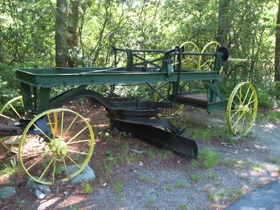 An old horse-drawn road grader.