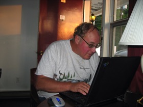 Back at the Hermitage Motel, Doug checks his email.