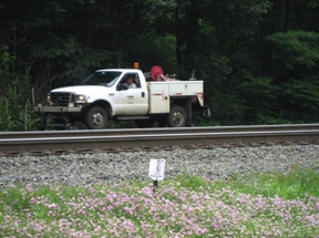 It's pretty busy here and we see a maintenance vehicle in addition the the many trains.