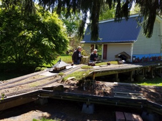 David Marconi and Jon Radder are getting ready to take some cars out of the barn to be put on the correct sidings for the ops session. David Marconi and Jon Radder are getting ready to take some cars out of the barn to be put on the correct sidings for the ops session.