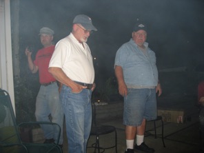 Bart, Ric, and Andy warm by the fire.