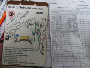 August 23.  Sunday was an ops session at Stan & Deb's railroad.  We ran from Deck to Solitude. This year Stan added switch lists...which the conductor made up from the car cards. In my case, I didn't do it quite right, but I now get the idea.
A schematic of the layout along with specific train instructions is on the back side of the clipboard.