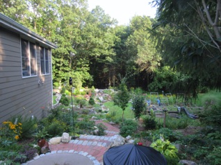 August 10.  Thursday.   We drive up to Littleton from Burke.  As you enter through the gate, you first encounter a nice new patio that Bob recently installed, with steps leading down to the layout.