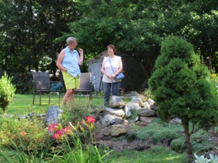 August 11.  Turning the camera left a bit and up the hill I spot Martha and Jean.