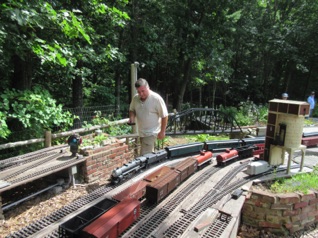 Dennis shows up with a gorgeous passenger train, shown here arriving at Burke yard. You can just see part of Franklin Falls to the left.