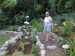 Martha showed off all the work they had done on the hillside.  We were there 2 years ago in August, but they have since changed the date to July as there is much more in bloom.   The yard was absolutely gorgeous everywhere you looked.   She has even "upgraded" the front yard, even though there isn't any track there (yet). 