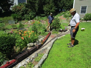 Ken took his train back down the hill to help Ric make it UP the hill...