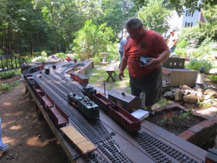 With two engines working the yard, it's not long until we have trains organized for departure. At the same time, we run a local that moves some cars from their industry locations into the yard. With two engines working the yard, it's not long until we have trains organized for departure. At the same time, we run a local that moves some cars from their industry locations into the yard.