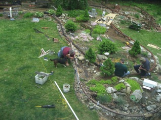 May 14.  Greta (the beagle/basset mix) thought that Jon needed a few ear licks to help him work... 