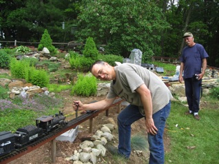 I cut some brass rod in an attempt to make a "golden" spike.  Bob drives the "golden" spike.