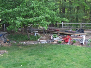 May 15. Saturday. We had to leave fairly early on Saturday morning - about 9:30. Just before I left I took these shots. Here's the left side of the layout. You can see the platform that Sean built just in front of the main yard; I got to prime it. Bob will be putting some code 215 switches and track there to complete it. May 15. Saturday. We had to leave fairly early on Saturday morning - about 9:30. Just before I left I took these shots. Here's the left side of the layout. You can see the platform that Sean built just in front of the main yard; I got to prime it. Bob will be putting some code 215 switches and track there to complete it.