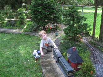 Andy had his own agenda. I was going to take the passenger train, but he was having too good of time playing with the cars. He's really good at putting the cars on the track...we thought it was because he was so much closer to the ground. 