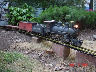 Had to add a few bricks to remove some of the steeper grades.
This is actually an opportunity to build a trestle. I could build up to the track with dirt, but then I might affect the drainage in the back yard. I don’t want ballast washing away.
Besides, a trestle will be a fun project.