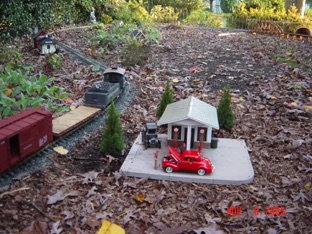 The train passes the gas station.