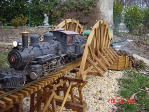 Passenger train crossing the camel-back bridge.