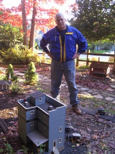 November 11.  Mike Oates next to his furniture company.