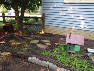 August 12.  We had been talking about putting another plant there, but I thought I'd try a couple of stepping stones instead.

I'm thinking I like this better, as it gives me a better place to walk. Previously I had been kicking the switch stands with my foot...now I should be far enough away. 