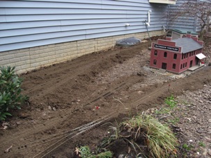 I'll be putting down ballast later. And lots of ground cover. Still got more to do. I think I need another couple yards, but first I need to build a retaining wall. I think I'll either use landscape timbers or some treated 4x4s. 