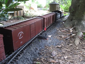 Coming off the passing siding next to the house.   That's Miracle Chair in the left background.