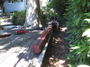 First the locomotive is separated from the train in preparation to run around it and push the cars into place in the yard.