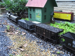 August 14.  Ken comes down for an ops session.   The hoppers and tank cars are on a spur that serves Mills Fuel.   Salmons Produce is in the background.