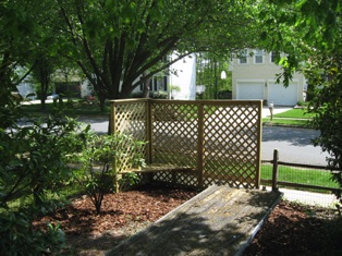 April 16.  Got some trim pieces and finished up the screen. Today we put some mulch around it and Jean planted some English ivy at the base. Hopefully it won't be too long until it starts growing up the screen. 