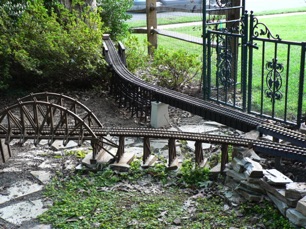 First, a Garden Metal bridge, my curved trestle, the Howe deck bridge and another Garden Metal bridge. It just clears the oak tree.