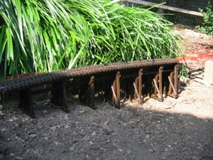 The rails are hand spiked to the ties and the assembly is put in place. The rails are hand spiked to the ties and the assembly is put in place.