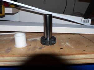 October 5, 2006. For my pivot, I got some parts from McMaster-Carr: 2 delrin sleeve bearings, a 3" steel rod, and a collar to hold the rod in place. Here it is shown upside down... October 5, 2006. For my pivot, I got some parts from McMaster-Carr: 2 delrin sleeve bearings, a 3" steel rod, and a collar to hold the rod in place. Here it is shown upside down...